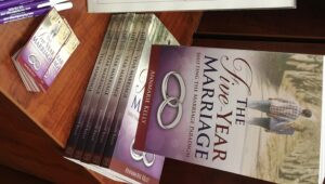 Stack of Five-Year Marriage books - relationship guide