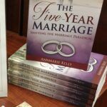 Stack of Five-Year Marriage books - relationship guide